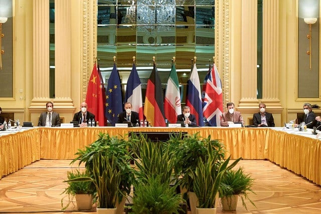 european external action service eeas deputy secretary general enrique mora and iranian deputy at ministry of foreign affairs abbas araghchi wait for the start of a meeting of the jcpoa joint commission in vienna austria april 17 2021 photo reuters