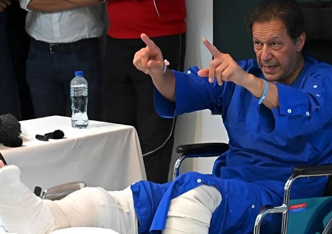 In this picture taken on on November 4, 2022, former prime minister Imran Khan addresses the media representatives at a hospital in Lahore, a day after an assassination attempt on him. — AFP