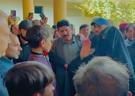 bushra bibi distributes rs10m cheques to two families of deceased protest workers