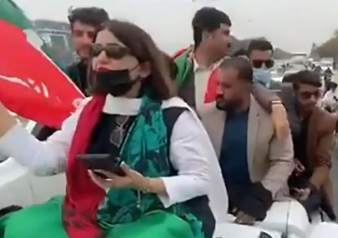 pti s seemabia tahir is seen sitting on top of a vehicle as she leads a protest rally in rawalpindi on march 10 2024 screengrab x balochi5252