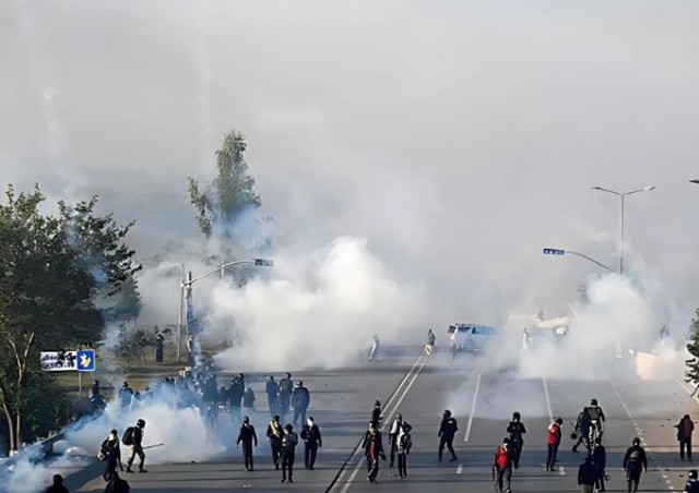 policemen fire tear gas shells to disperse supporters of pakistan tehreek e insaf pti party during a protest to demand the release of former prime minister imran khan in islamabad on november 26 2024 photo afp file