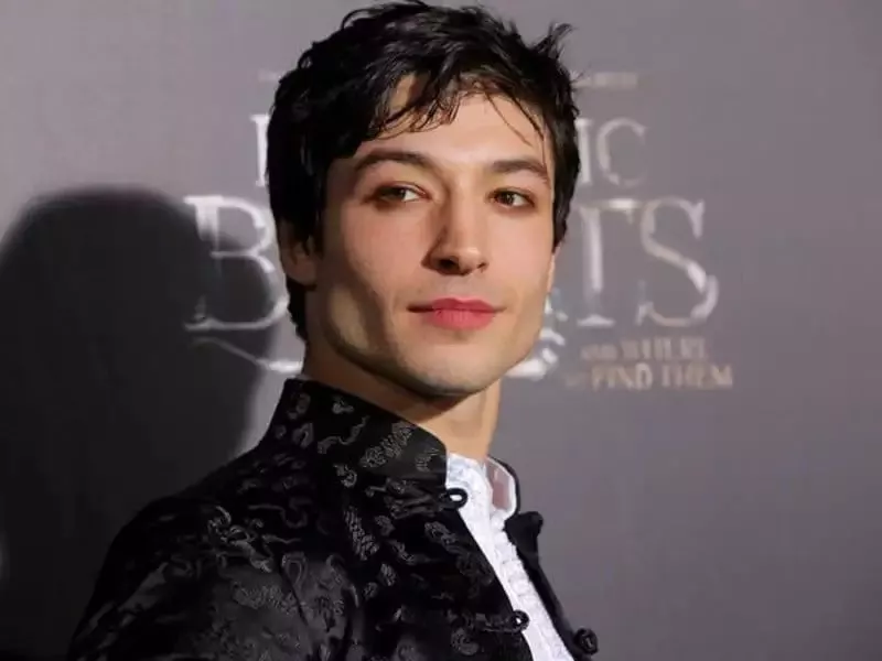 father withdraws grooming allegations against ezra miller supports child s band