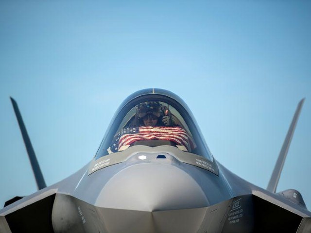 an f 35 pilot prepares for take off from the vermont air national guard base with the flag of the united states before a flyover in south burlington vermont us may 22 2020 photo reuters file
