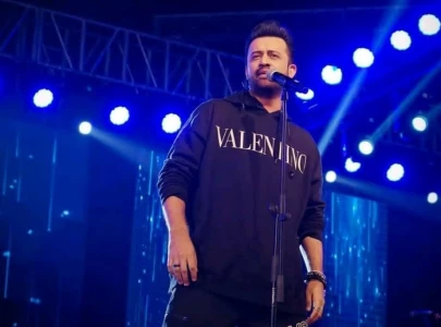 atif aslam arrives at concert on a bike leaves fans gushing and questioning