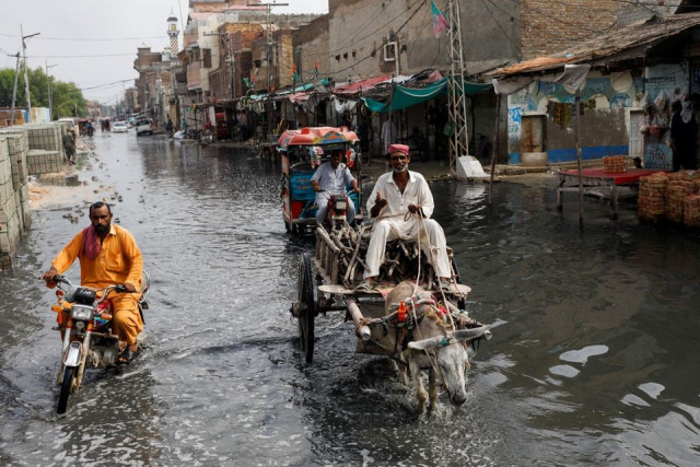 a man rides on donkey cart through rain waters following rains and floods during the monsoon season in jacobabad pakistan august 30 2022 reuters a man rides on donkey cart through rain waters following rains and floods during the monsoon season in jacobabad pakistan august 30 2022 reuters