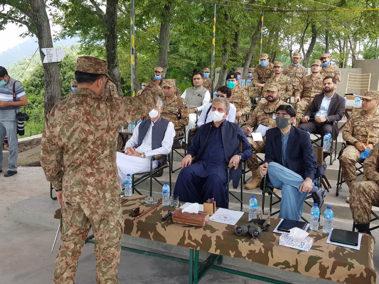 an army official briefs fm qureshi minister for defence pervez khattak and sapm on national security dr moeed yusuf during their visit to loc photo express