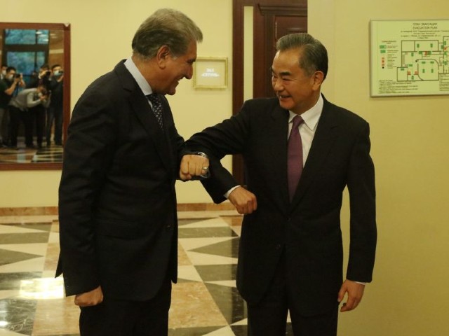 foreign minister makhdoom shah mahmood qureshi greets chinese foreign minister wang yi before the bilateral meeting on the sidelines of shanghai cooperation organization sco council of foreign ministers in moscow on thursday photo express