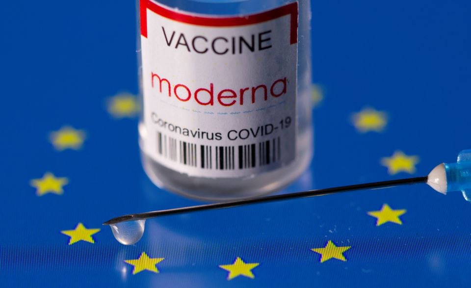 vial labelled moderna coronavirus disease covid 19 vaccine placed on displayed eu flag is seen in this illustration picture taken march 24 2021 photo reuters