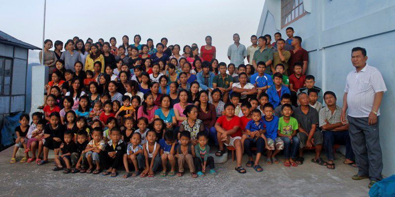 family members of ziona r poses for group photograph outside their residence in baktawng village in the northeastern indian state of mizoram october 7 2011 ziona has 39 wives 94 children and 33 grandchildren photo reuters