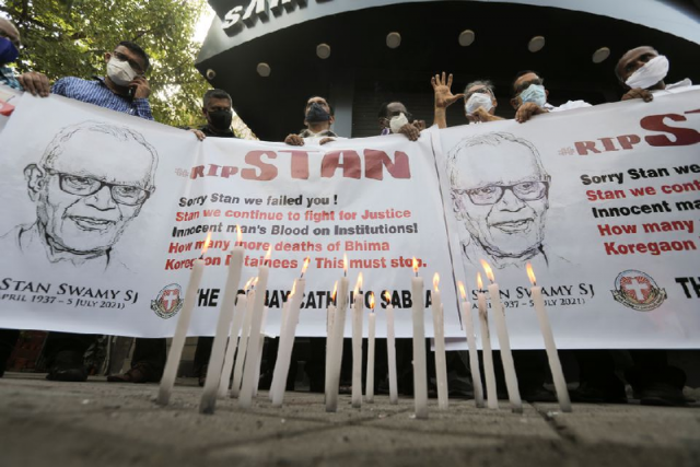 people hold a banner during a prayer meet for 84 year old indian christian priest and activist father stanislaus lourduswamy photo reuters people hold a banner during a prayer meet for 84 year old indian christian priest and activist father stanislaus lourduswamy photo reuters