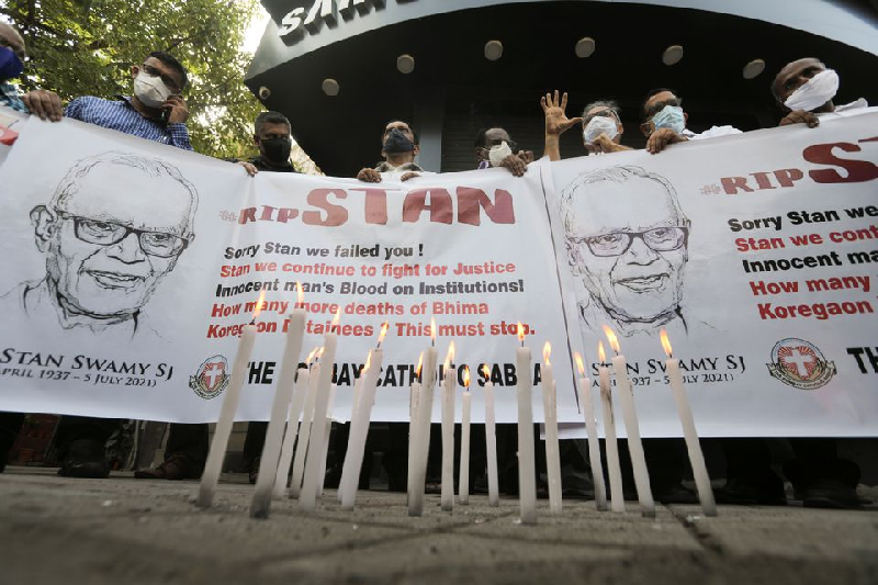 people hold a banner during a prayer meet for 84 year old indian christian priest and activist father stanislaus lourduswamy photo reuters