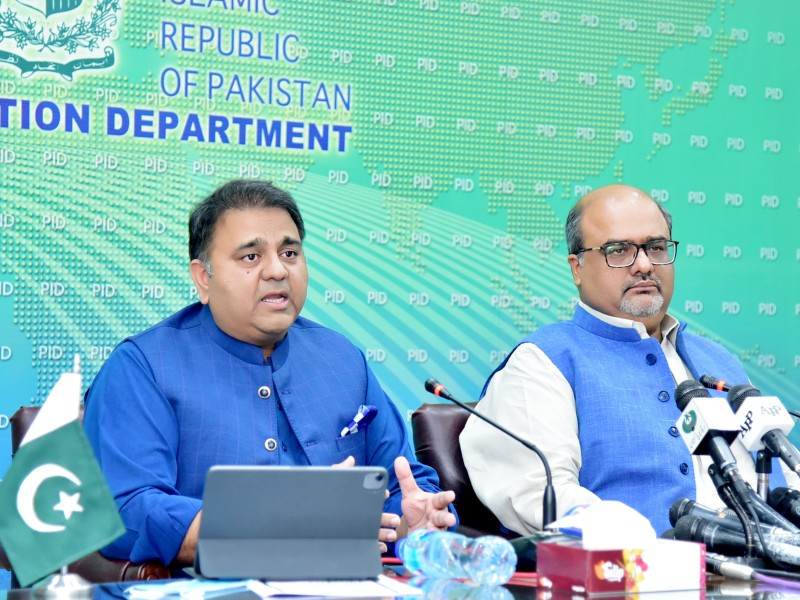 federal minister for information and broadcasting chaudhry fawad hussain along with advisor to pm on accountability mirza shahzad akbar addressing a press conference in islamabad on july 24 2021 photo pid