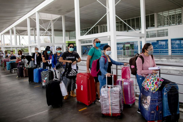 repatriated overseas filipino workers or ofws arrive at an airport after being allowed to go home following weeks of quarantine amid the spread of the coronavirus disease covid 19 in pasay city metro manila philippines may 26 2020 photo reuters repatriated overseas filipino workers or ofws arrive at an airport after being allowed to go home following weeks of quarantine amid the spread of the coronavirus disease covid 19 in pasay city metro manila philippines may 26 2020 photo reuters