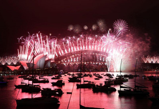 fireworks explode over empty streets as 2020 slinks away into history fireworks explode over empty streets as 2020 slinks away into history