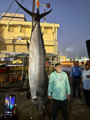 big fish angler khalid with his 210kg marlin at karachi fish harbour and the receipt of the fishery weighbridge photo zubair nazeer khan express big fish angler khalid with his 210kg marlin at karachi fish harbour and the receipt of the fishery weighbridge photo zubair nazeer khan express