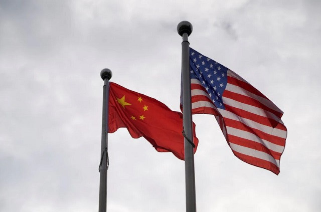 chinese and us flags flutter outside a company building in shanghai china november 16 2021 photo reuters