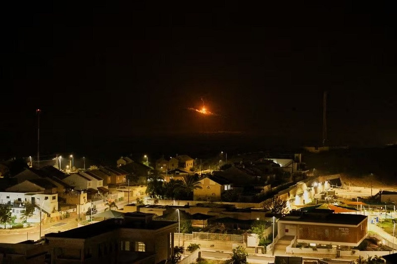 A flare falls over Gaza, as seen from southern Israel, January 1, 2024. PHOTO: REUTERS