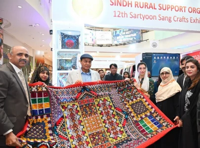 women from flood hit areas display crafts