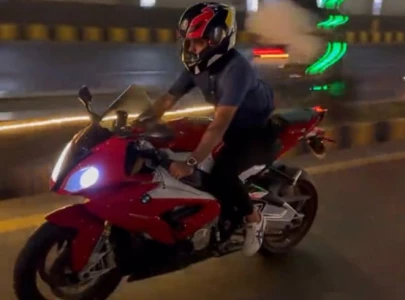 babar azam s motorbike ride sparks safety concerns among fans
