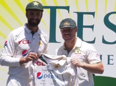 watch shan masood presents babar azam s signed jersey to david warner