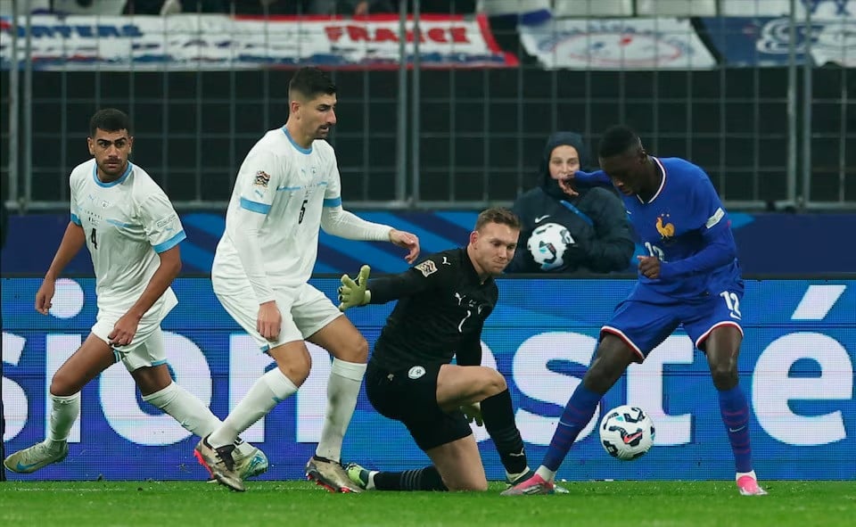 israel s daniel peretz in action with france s randal kolo muani during nations league group stage match at stade de france saint denis france on november 14 2024 photo reuters