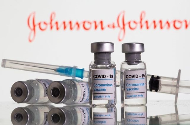 vials labelled covid 19 coronavirus vaccine and sryinge are seen in front of displayed johnson johnson logo in this illustration taken february 9 2021 photo reuters