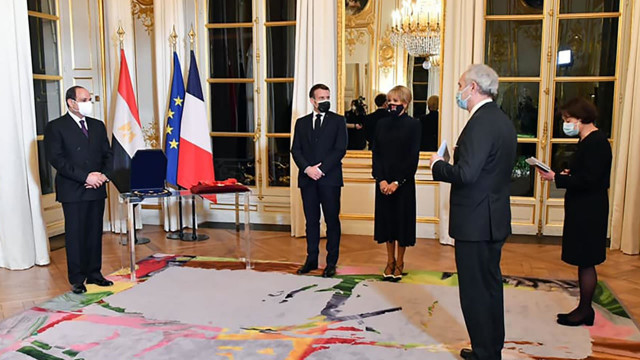 this picture released by the egyptian presidency shows president abdel fattah al sisi receiving the legion d honneur at the elysee palace   egyptian presidency afp