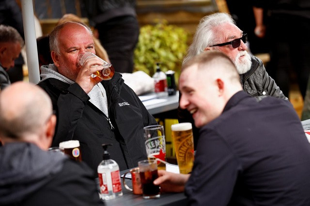 customers at the swinging witch pub enjoy drinks as lockdown eases amid the coronavirus disease covid 19 pandemic in northwich cheshire britain may 15 2021 photo reuters