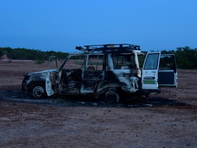 the bodies were found next to the burned out wreckage of the group s vehicle photo afp the bodies were found next to the burned out wreckage of the group s vehicle photo afp