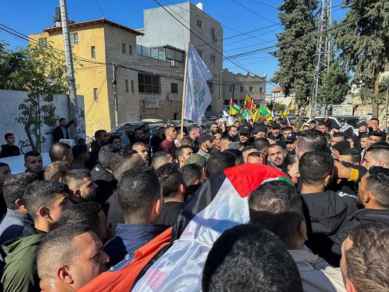 Mourners carry the body of 38-year-old Palestinian, Ahmad Assi, who was killed in an Israeli settler raid, during his funeral near Salfit in the Israeli-occupied West Bank December 3, 2023. PHOTO: REUTERS