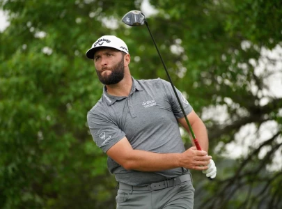 rahm ousted scheffler and mcilroy advance at match play