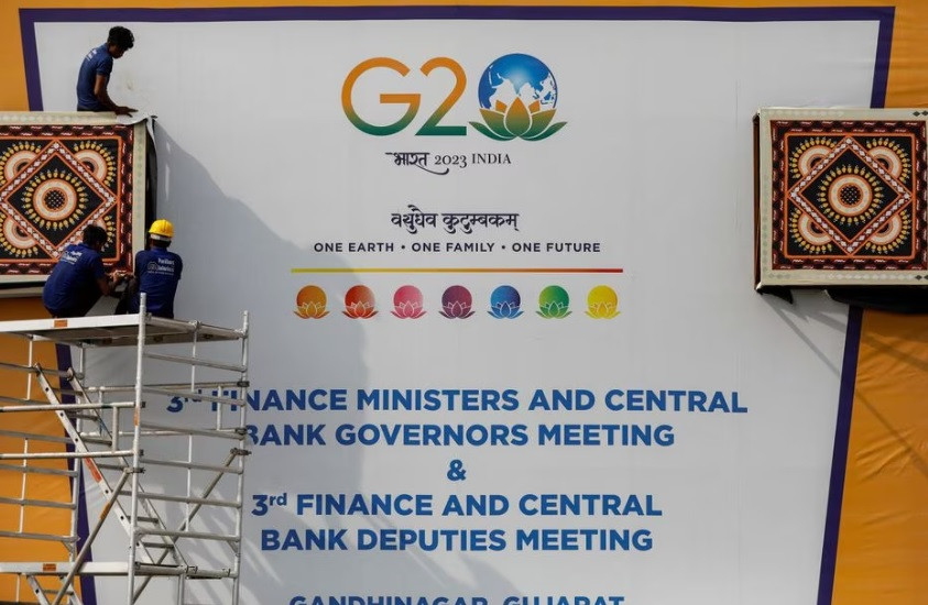 workers work to install a hoarding board near the venue of g20 finance ministers and central bank governors meeting at gandhinagar in gujarat india july 13 2023 reuters amit dave file photo