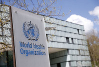 a logo is pictured outside a building of the world health organisation who in geneva switzerland april 6 2021 photo reuters file