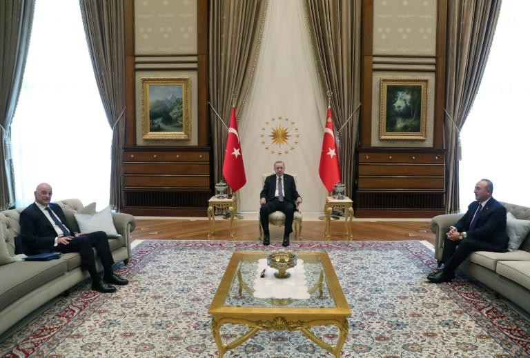 turkish president recep tayyip erdogan seated at centre receives greek foreign minister nikos dendias at left at the presidential complex in ankara mustafa kamaci photo afp