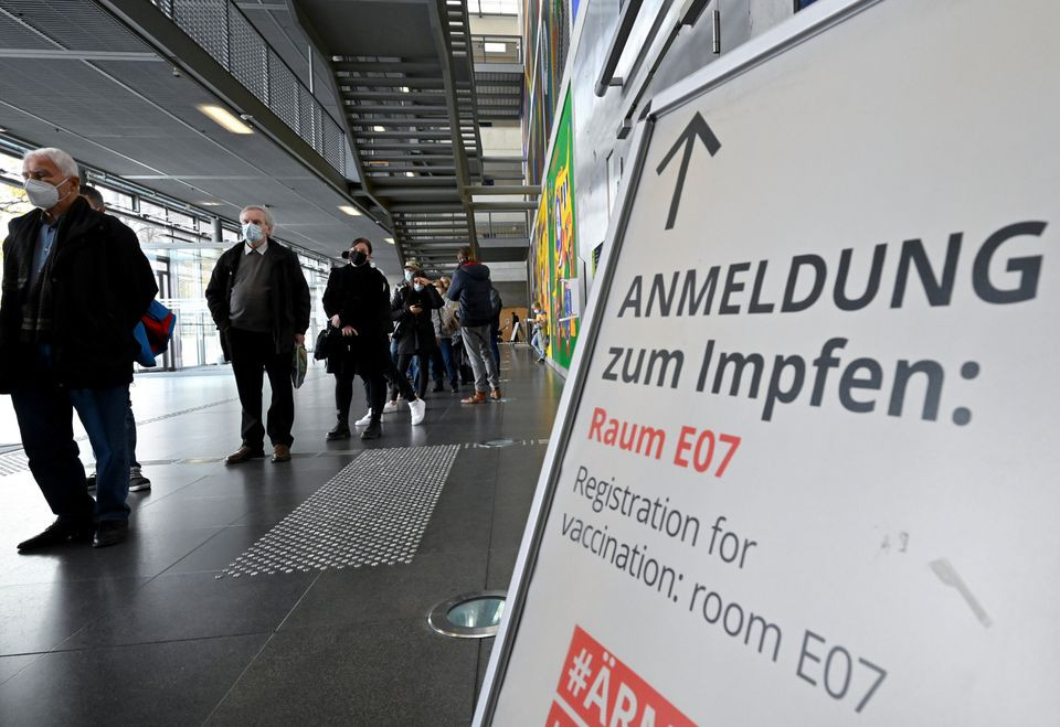 people queue up for vaccination at a temporary vaccination centre inside the campus building of the technische universitaet university in dresden germany november 8 2021 photo reuters