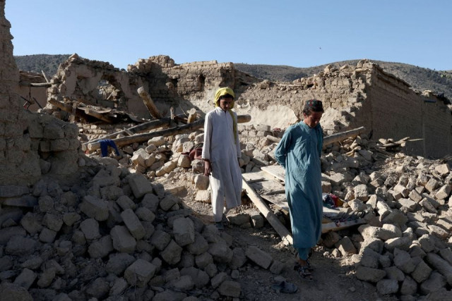 afghan people walk through the debris of damaged houses after the recent earthquake in wor kali village in the barmal district of paktika province afghanistan june 25 2022 photo reuters afghan people walk through the debris of damaged houses after the recent earthquake in wor kali village in the barmal district of paktika province afghanistan june 25 2022 photo reuters