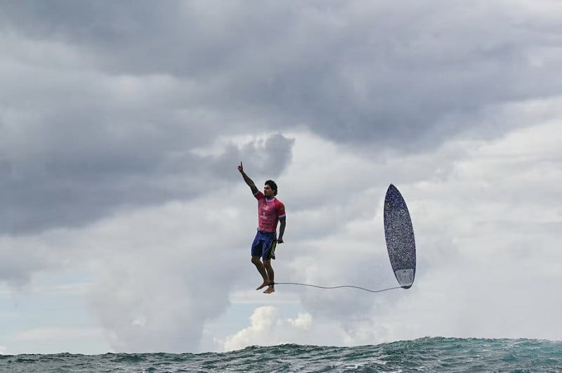 gabriel medina and his board appearing to levitate above the waves with medina s raised index finger signalling his triumph photo afp
