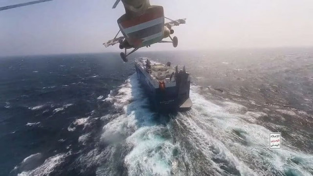 houthi military helicopter flies over the galaxy leader cargo ship in the red sea in this photo released november 20 2023 photo reuters