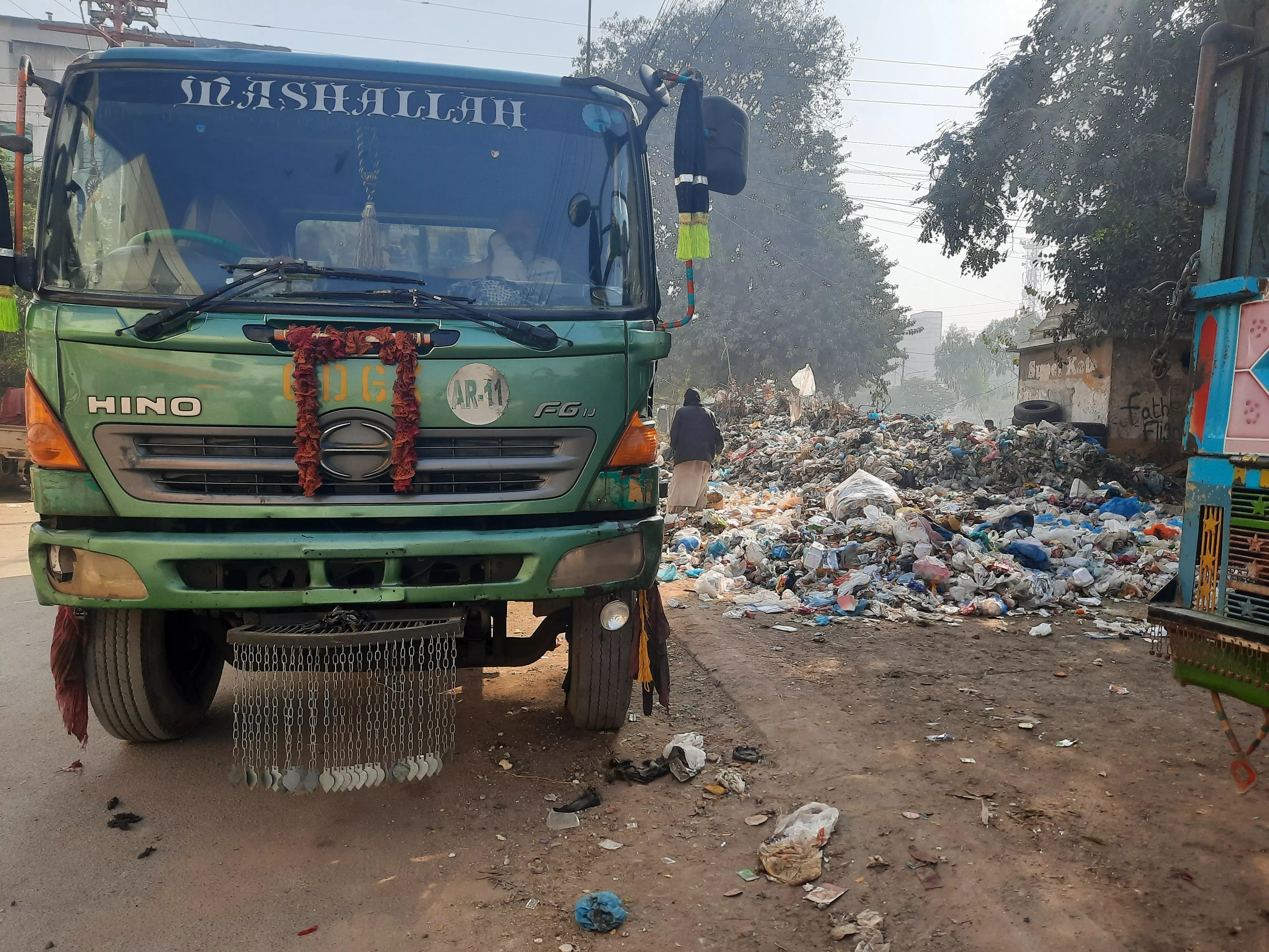 capital struggles with heaps of garbage