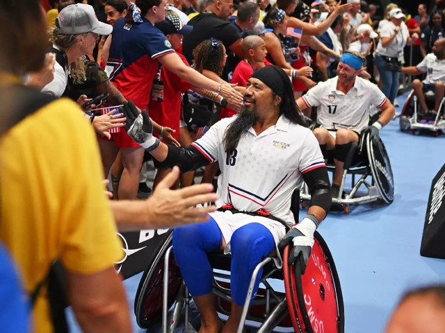 Garrett Kuwada of Team USA celebrates after winning in the Mixed Team Wheelchair Rugby Gold Medal match between Team United States and Team United Kingdom. Lukas Schulze/Getty