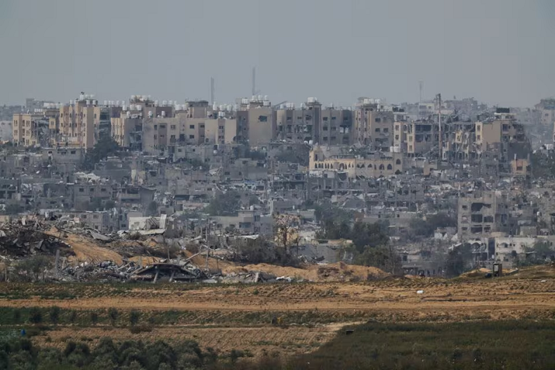 Destroyed buildings lay in ruin in Gaza, as seen from southern Israel, November 25, 2023. PHOTO: REUTERS