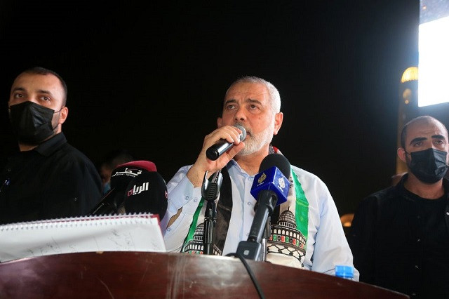 Palestinian group Hamas' top leader, Ismail Haniyeh speaks during a protest to express solidarity with the Palestinian people amid a flare-up of Israeli-Palestinian violence, in Doha, Qatar May 15, 2021. PHOTO: REUTERS