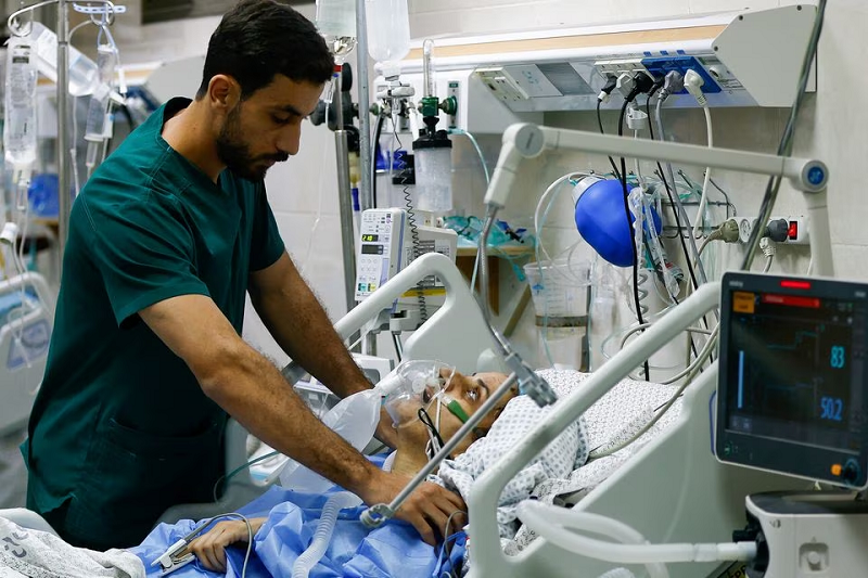 a medical worker assists a palestinian at the icu of nasser hospital in khan younis in the southern gaza strip october 26 2023 photo reuters