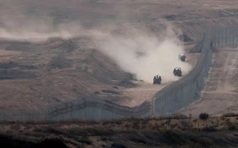 military vehicles manoeuvre next to a fence as seen from the israeli side of the border with gaza november 5 2023 photo reuters military vehicles manoeuvre next to a fence as seen from the israeli side of the border with gaza november 5 2023 photo reuters