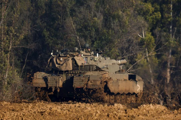 An Israeli tank manoeuvres near the Israel-Gaza border. PHOTO: Reuters