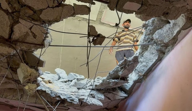 a palestinian man inspects the site of an israeli strike on a house amid israel hamas conflict in gaza city august 12 2024 photo reuters a palestinian man inspects the site of an israeli strike on a house amid israel hamas conflict in gaza city august 12 2024 photo reuters