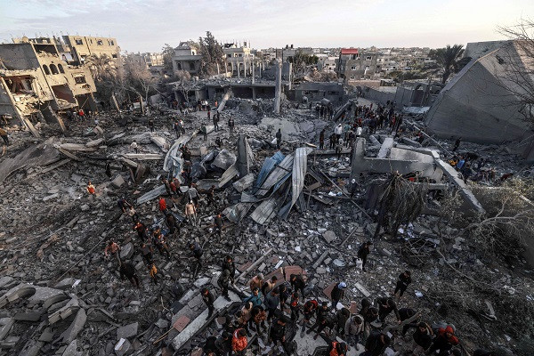 palestinians stand amidst the rubble of a mosque and buildings which were destroyed by israeli bombardment around the town city of rafah southern gaza strip photo afp