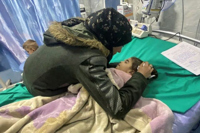 palestinian mother anwar abdulnabi cries over the body of her daughter mila who had been suffering from deficiencies of calcium and potassium at kamal adwan hospital on the edges of beit lahiya in the northern gaza photo reuters palestinian mother anwar abdulnabi cries over the body of her daughter mila who had been suffering from deficiencies of calcium and potassium at kamal adwan hospital on the edges of beit lahiya in the northern gaza photo reuters