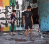 children inspect the damage at the site of the israeli strike on a school housing displaced palestinians on september 21 2024 photo afp