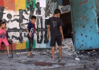 children inspect the damage at the site of the israeli strike on a school housing displaced palestinians on september 21 2024 photo afp